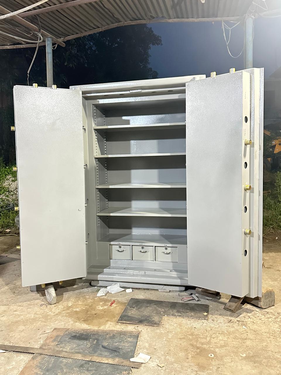 Open white Ajanta safe with dark reinforced door lining and storage shelves